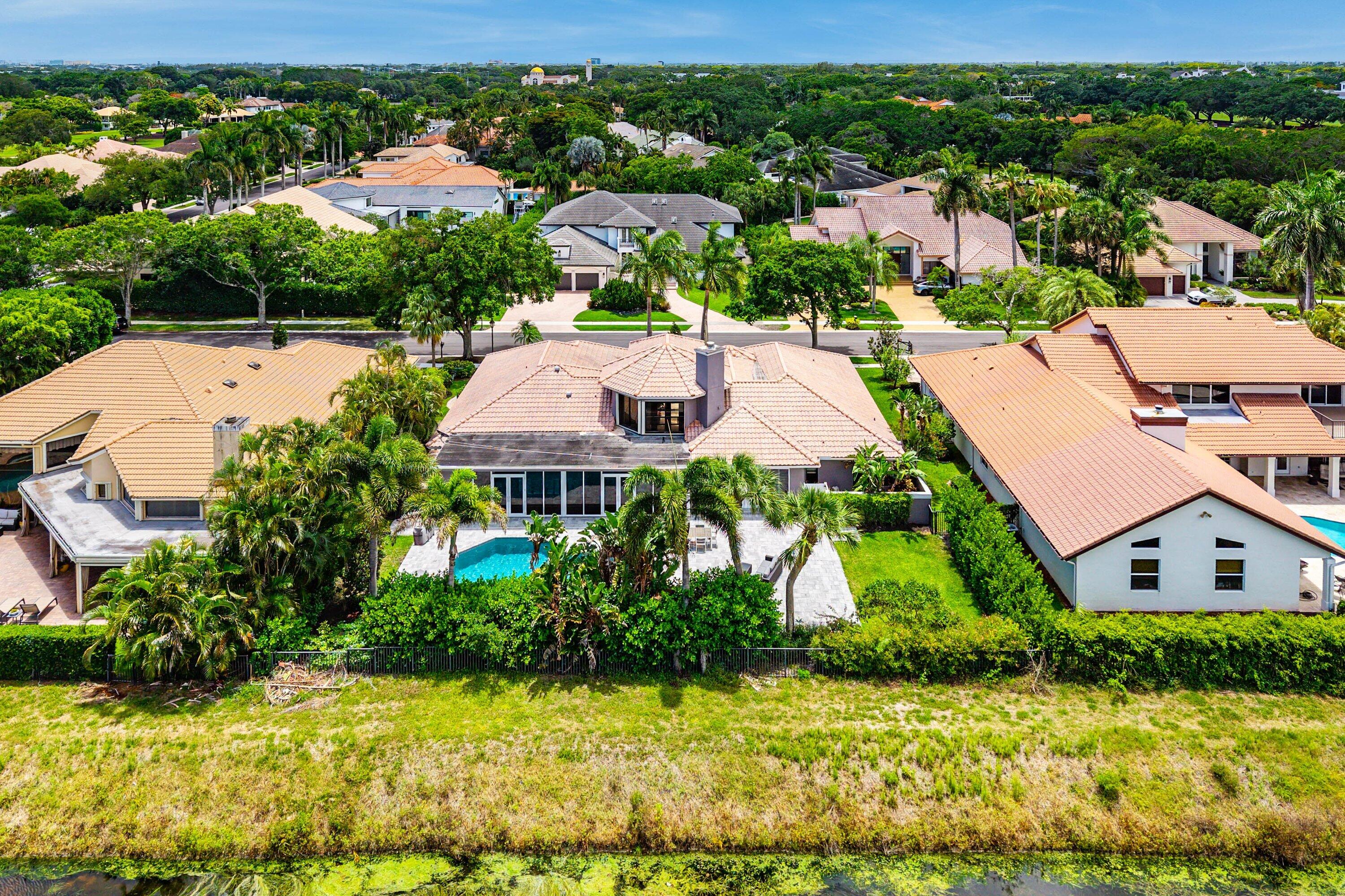 2357 Northwest 59th Street Boca Raton, FL 33496 - Photo 57 of 88 an aerial view of multiple houses with yard