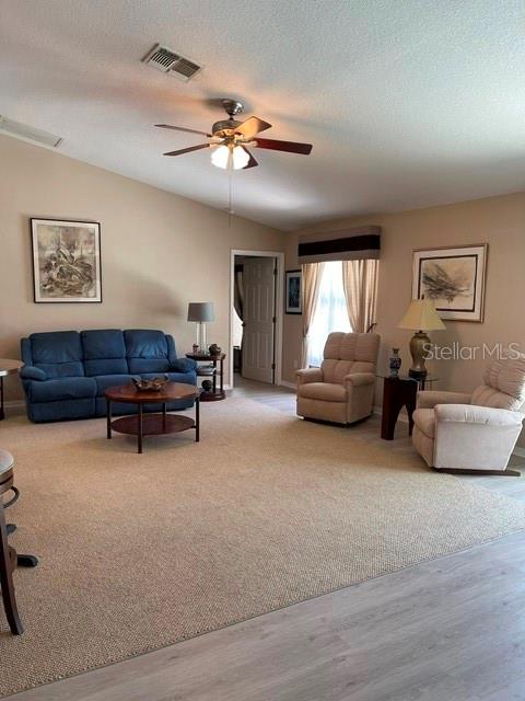 10985 Southwest 48th Terrace Ocala, FL 34476 - Photo 26 of 73 a living room with furniture and a ceiling fan