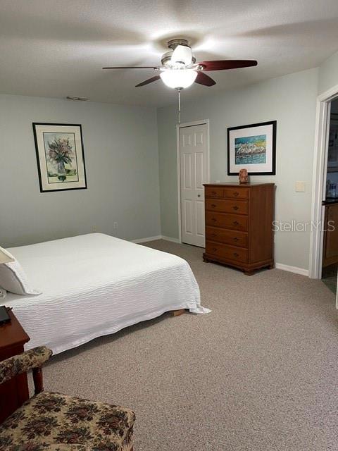 10985 Southwest 48th Terrace Ocala, FL 34476 - Photo 27 of 73 a bedroom with a bed chandelier and a window