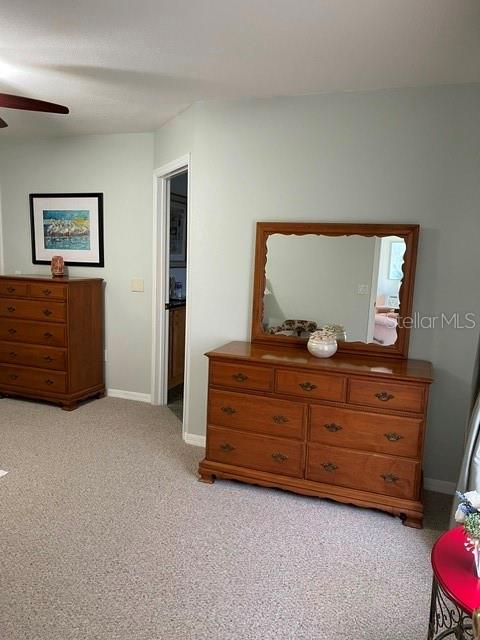 10985 Southwest 48th Terrace Ocala, FL 34476 - Photo 28 of 73 a room with a bed and a dresser