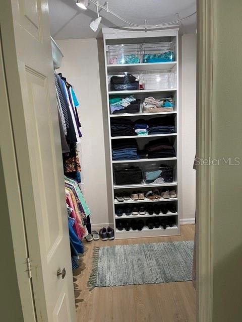 10985 Southwest 48th Terrace Ocala, FL 34476 - Photo 31 of 73 a view of walk in closet with clothes and shoes