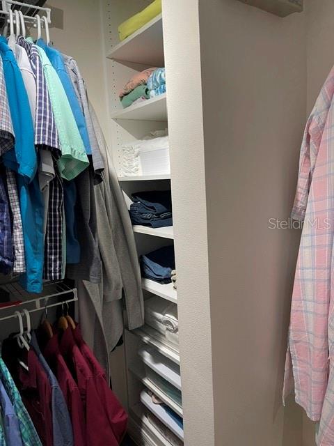 10985 Southwest 48th Terrace Ocala, FL 34476 - Photo 32 of 73 a view of walk in closet with clothes and shoes