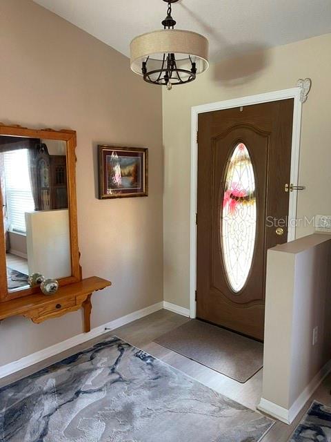 10985 Southwest 48th Terrace Ocala, FL 34476 - Photo 6 of 73 a view of a livingroom with furniture and mirror