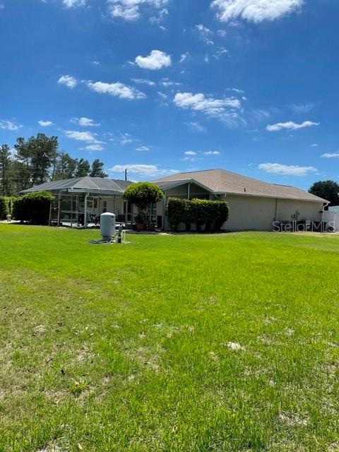 10985 Southwest 48th Terrace Ocala, FL 34476 - Photo 71 of 73 a view of a green field with house in the background