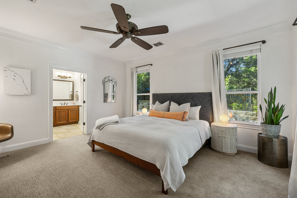 9116 Villa Norte Drive Austin, TX 78726 - Photo 13 of 40 a spacious bedroom with a bed and a large window