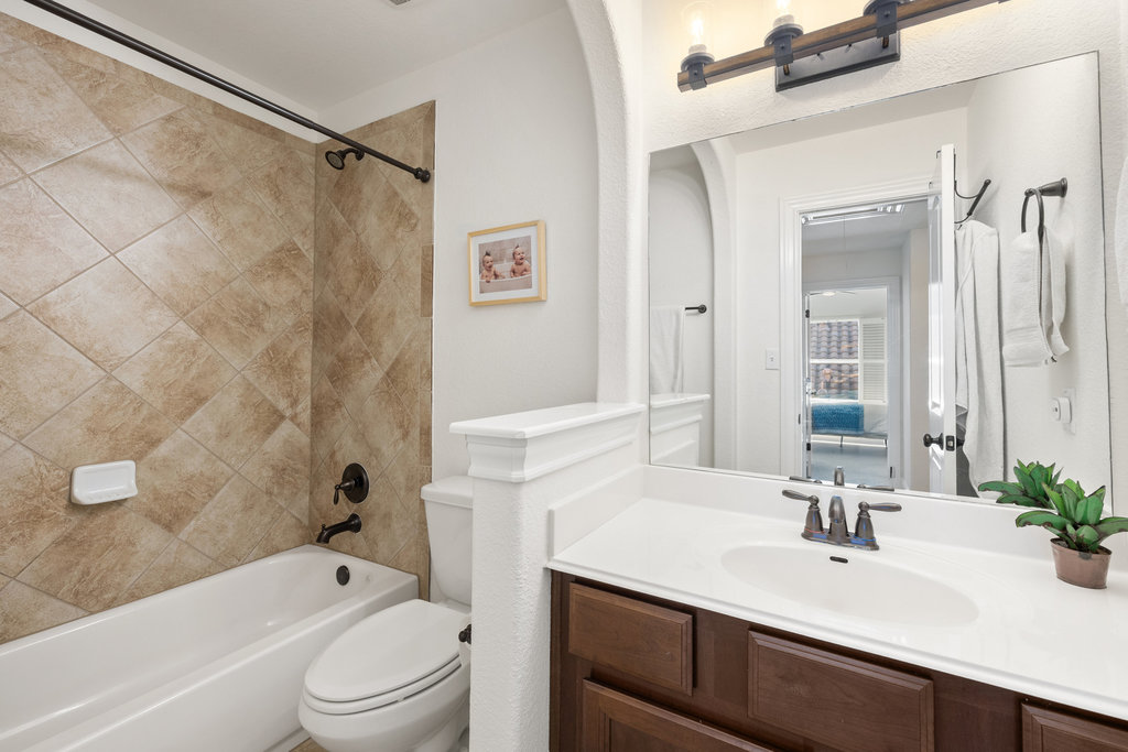 9116 Villa Norte Drive Austin, TX 78726 - Photo 19 of 40 a bathroom with a sink a toilet and shower