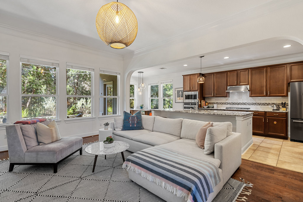 9116 Villa Norte Drive Austin, TX 78726 - Photo 22 of 40 a living room with furniture and a large window
