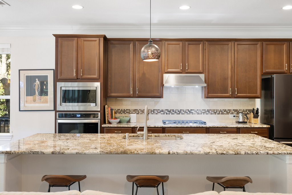 9116 Villa Norte Drive Austin, TX 78726 - Photo 30 of 40 a kitchen with stainless steel appliances granite countertop a sink and cabinets