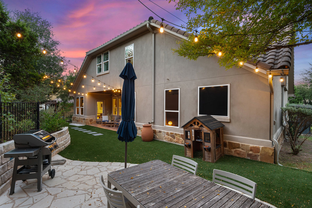9116 Villa Norte Drive Austin, TX 78726 - Photo 3 of 40 a view of a patio with a table chairs and a fire pit