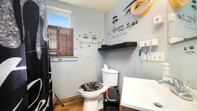 a bathroom with a sink toilet and shower