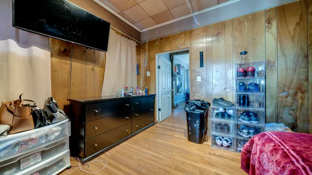 a bedroom with a bed and a dresser