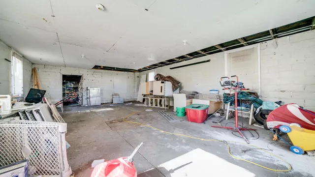 a bedroom with furniture and wooden floor