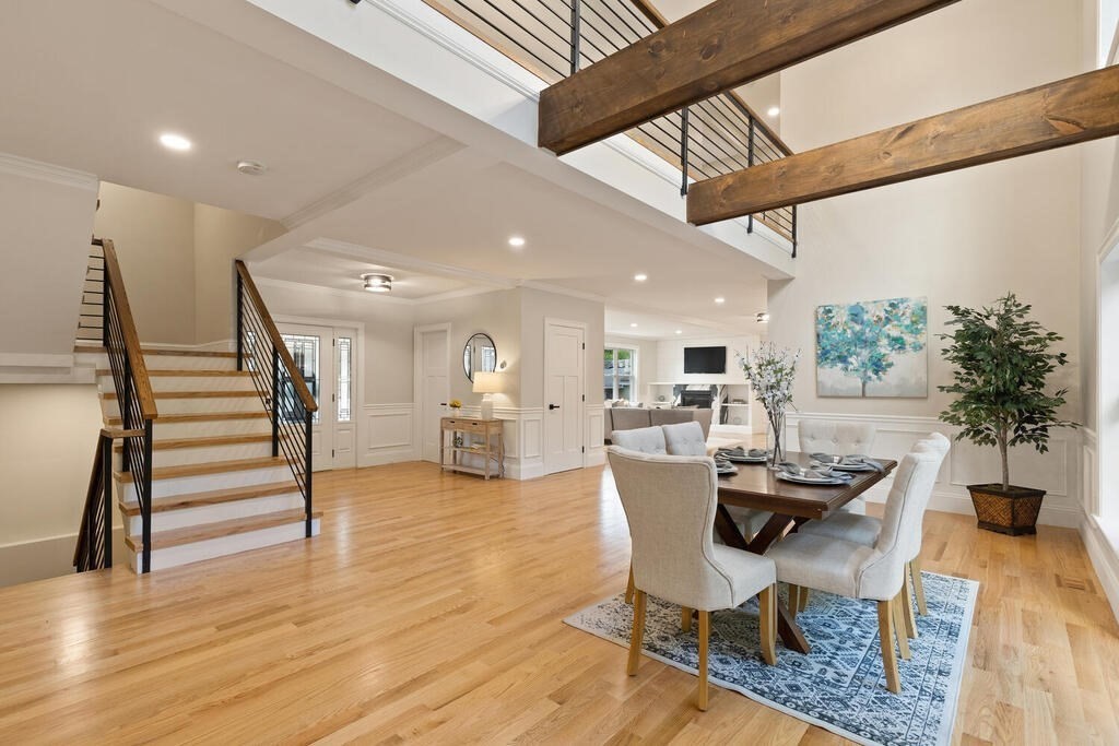 a dining room with furniture and wooden floor