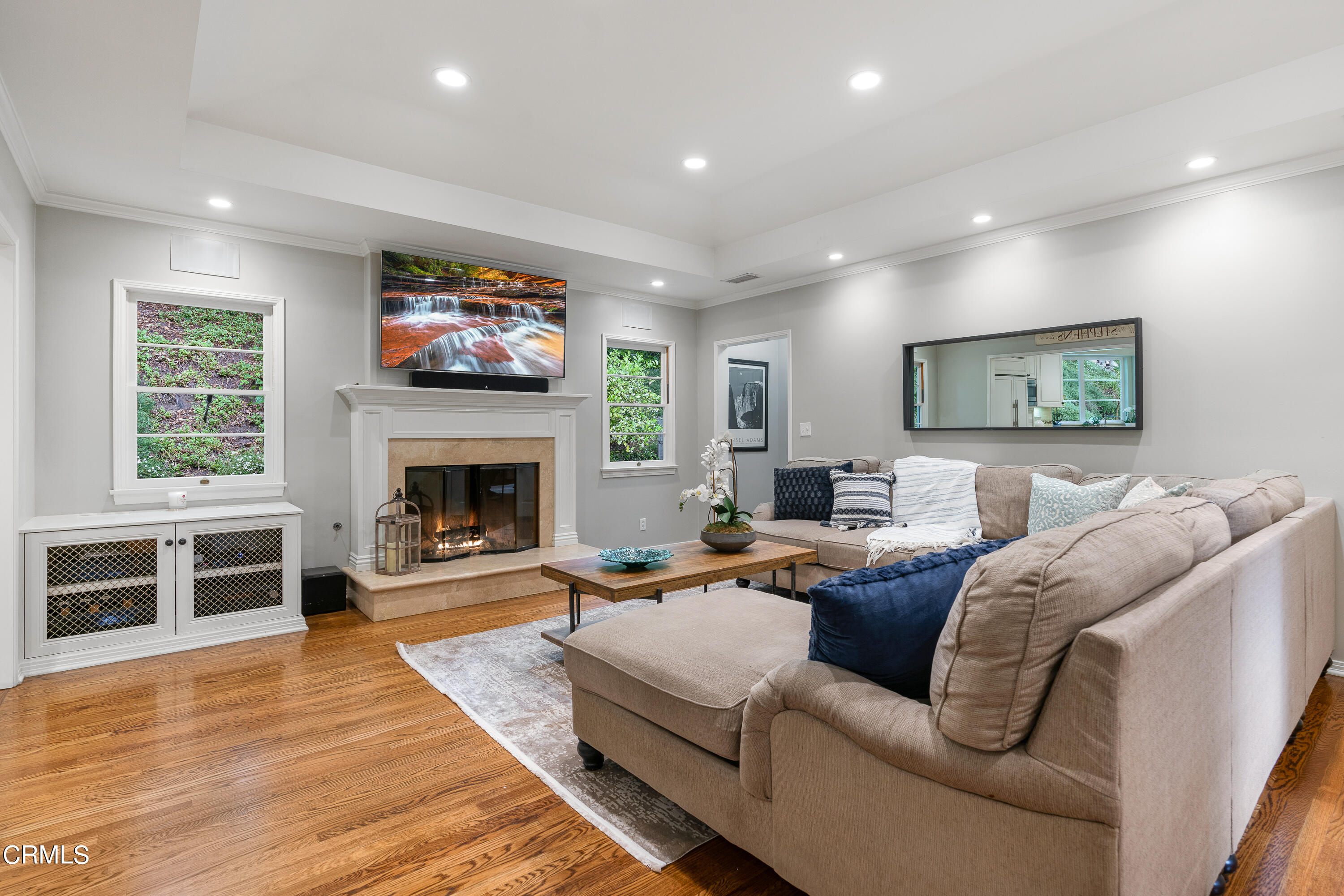 1265 Inverness Drive Pasadena, CA 91103 - Photo 11 of 44 a living room with furniture a flat screen tv and a fireplace