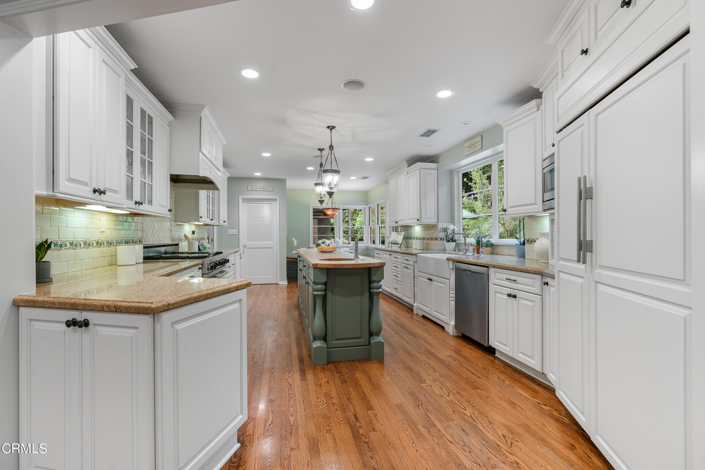 1265 Inverness Drive Pasadena, CA 91103 - Photo 12 of 44 a kitchen with granite countertop white cabinets and white appliances
