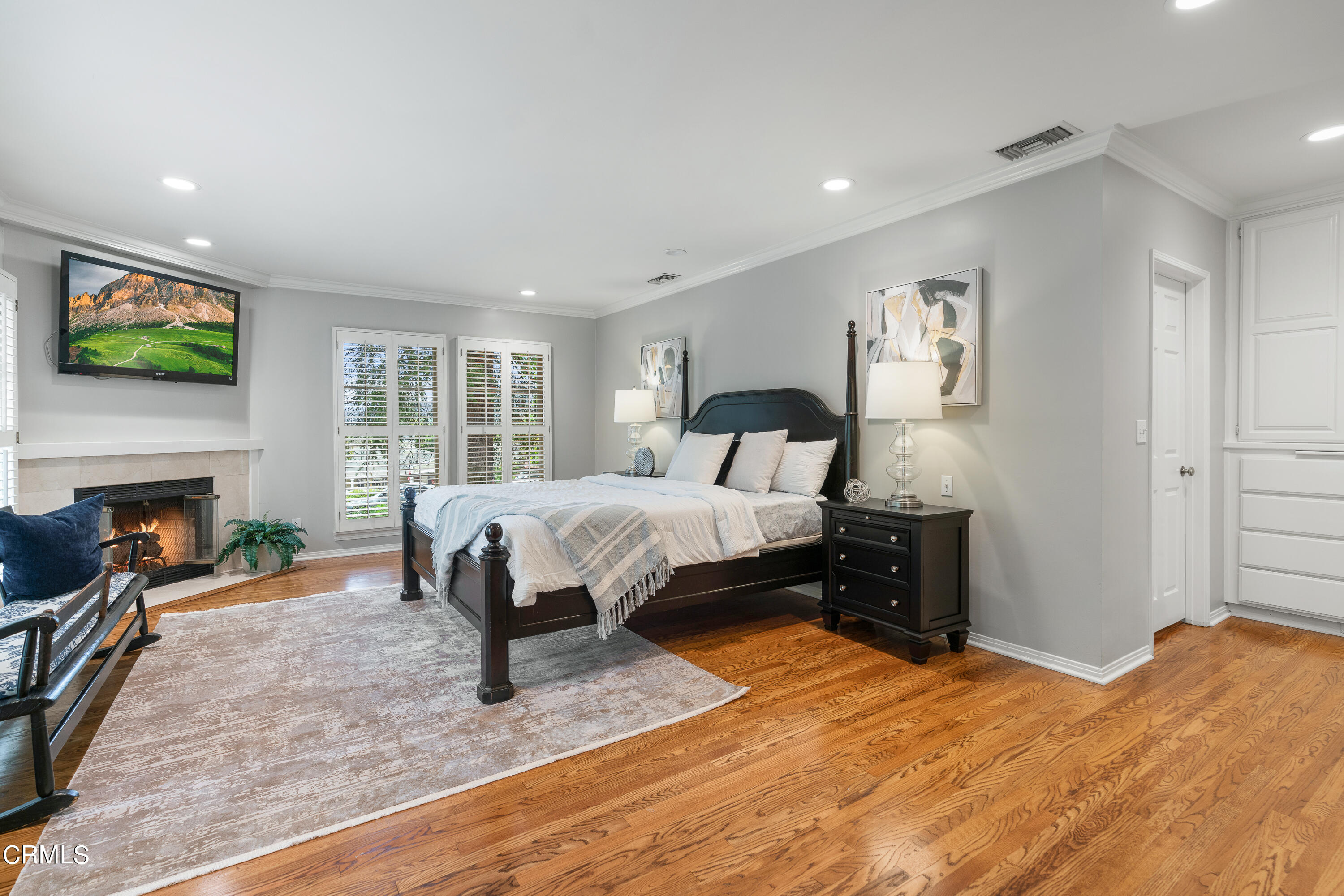 1265 Inverness Drive Pasadena, CA 91103 - Photo 19 of 44 a bedroom with a bed and a fireplace