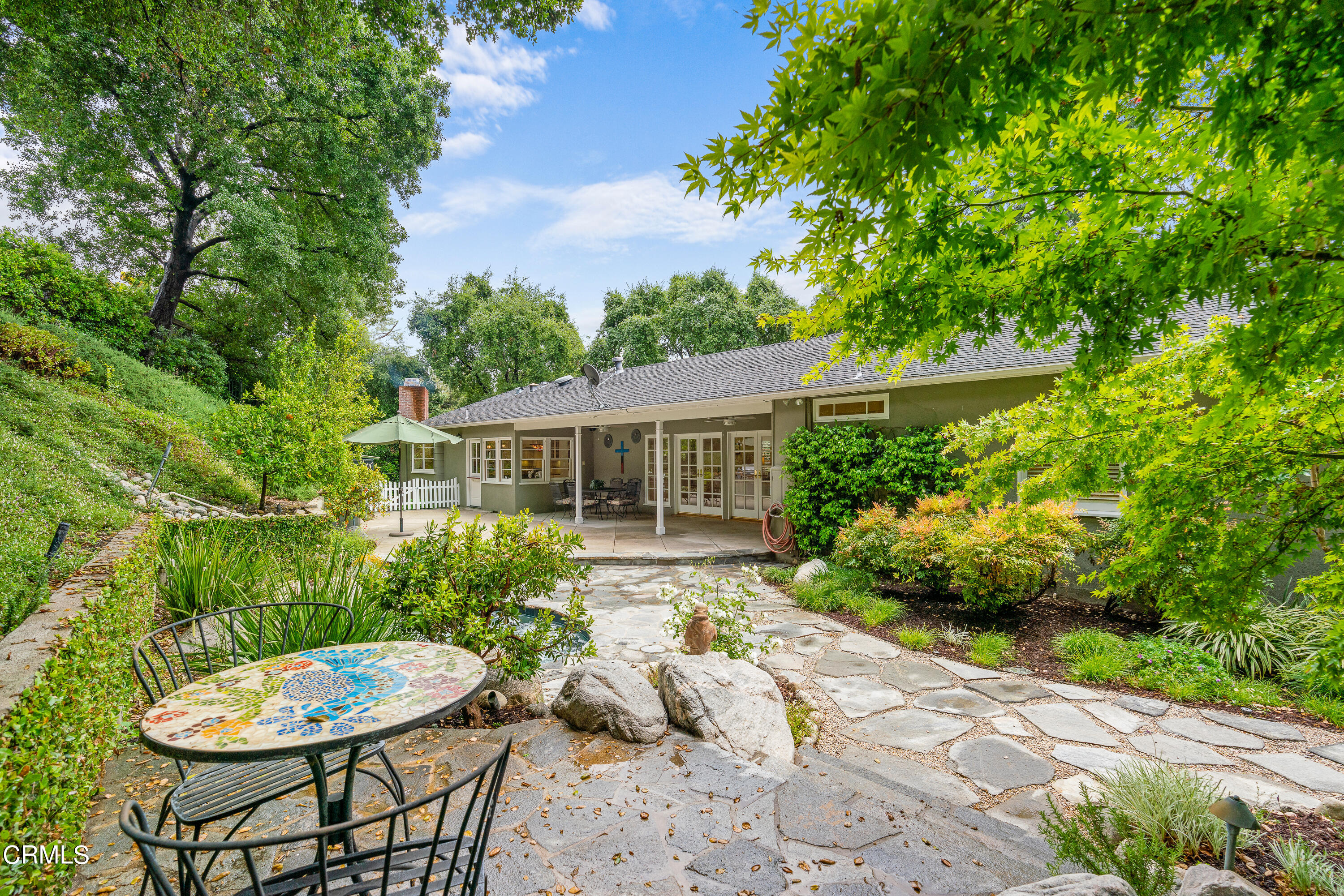 1265 Inverness Drive Pasadena, CA 91103 - Photo 32 of 44 a view of a chair and table in backyard of the house