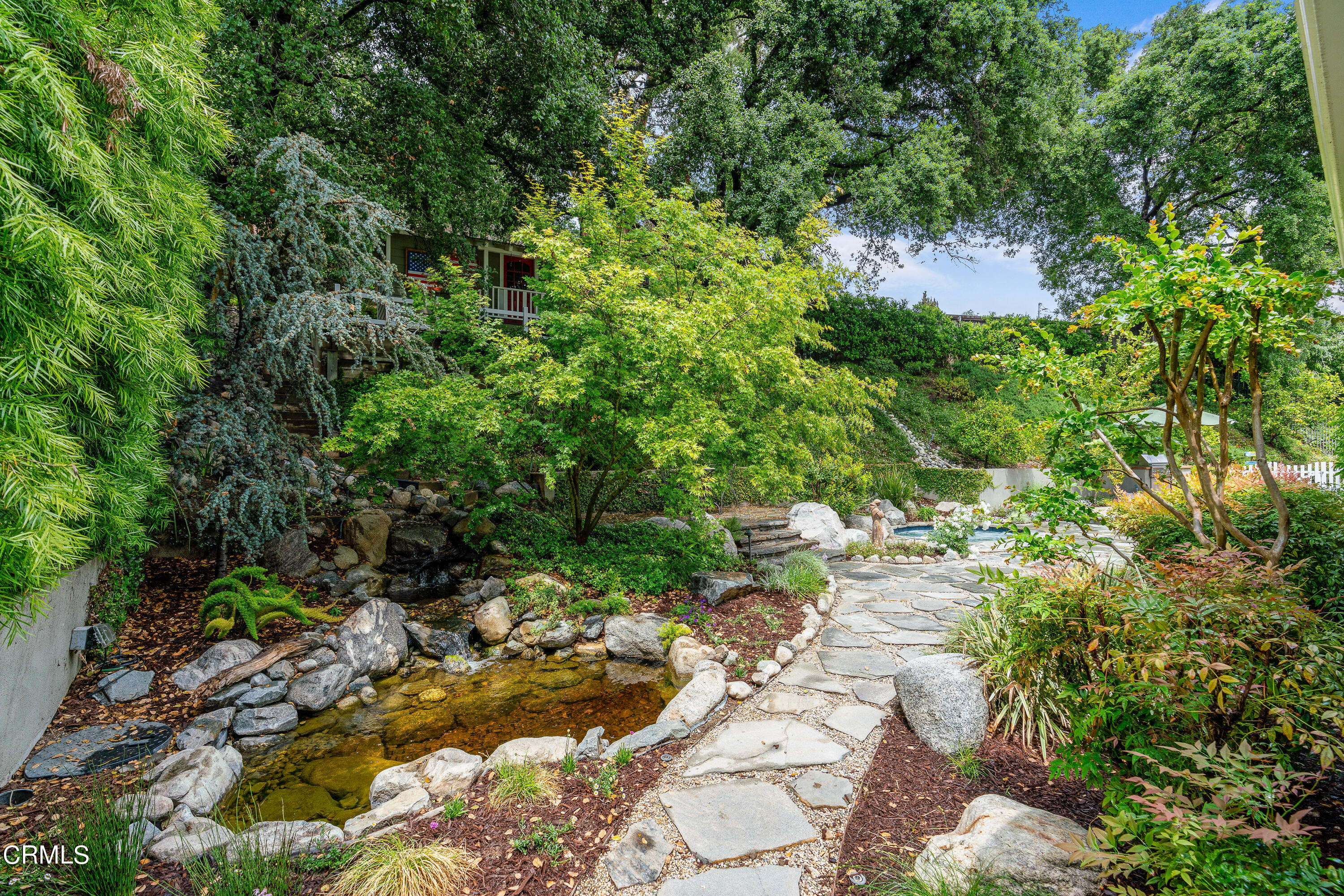 1265 Inverness Drive Pasadena, CA 91103 - Photo 33 of 44 a view of a garden with lawn chairs