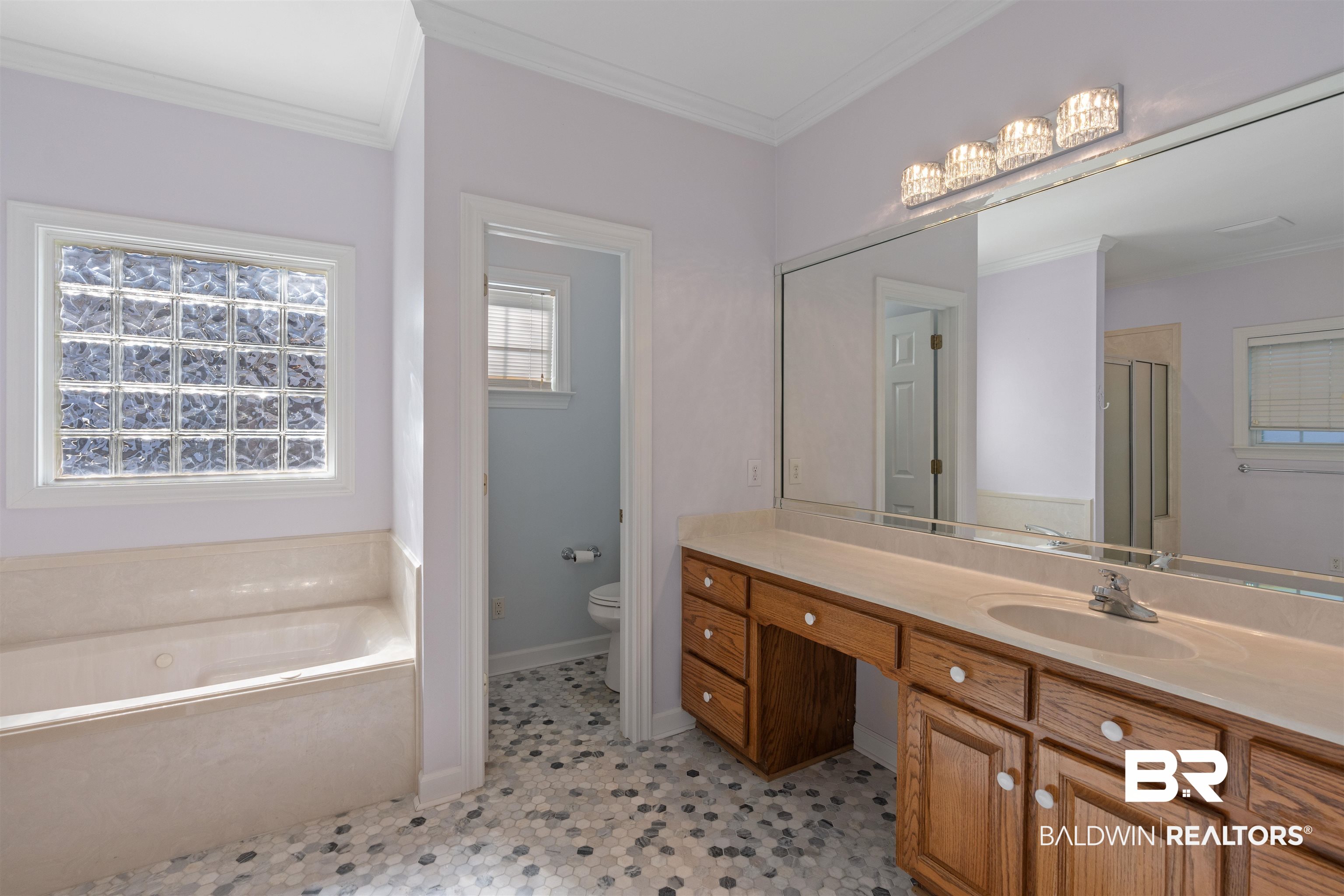 4 Judd Trail Daphne, AL 36527 - Photo 27 of 45 Full bathroom with crown molding, baseboards, toilet, a garden tub, and vanity