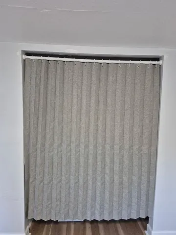 a view of a curtain with a black gate