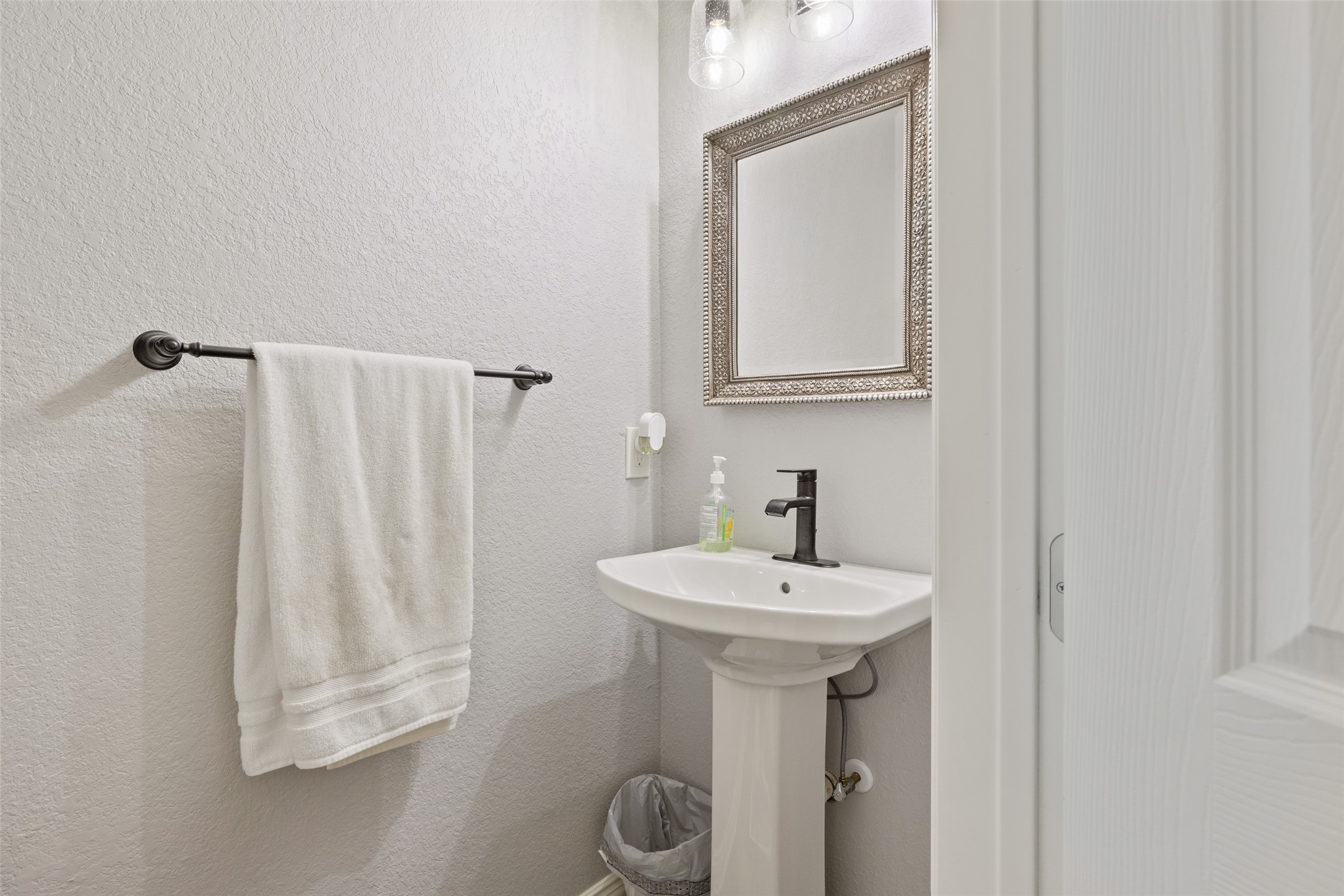 134 Prairie Springs Cove Georgetown, TX 78626 - Photo 15 of 34 a bathroom with a sink a mirror and vanity