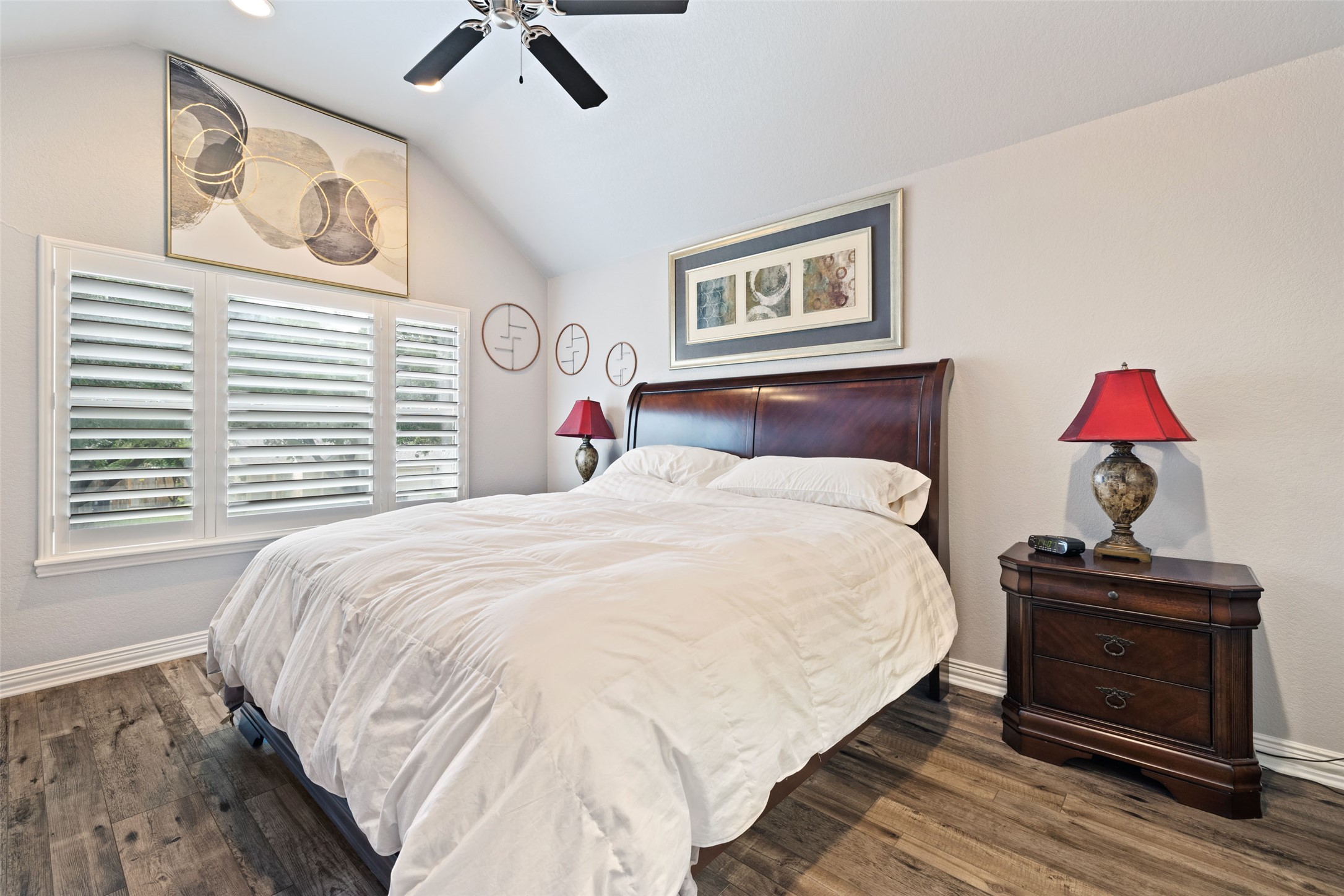 134 Prairie Springs Cove Georgetown, TX 78626 - Photo 16 of 34 a bedroom with a bed and a chandelier