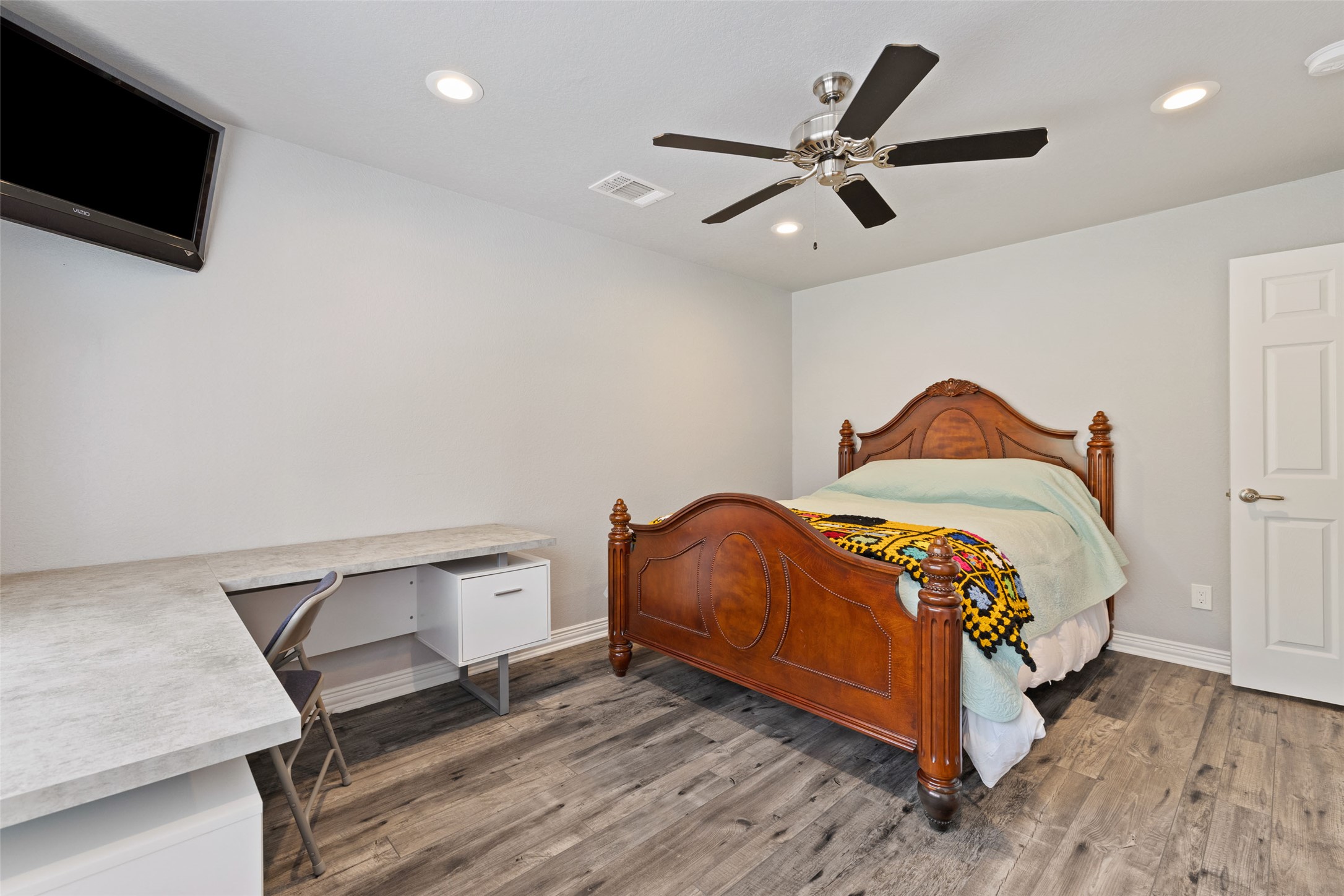 134 Prairie Springs Cove Georgetown, TX 78626 - Photo 28 of 34 a bedroom with a bed and a flat screen tv