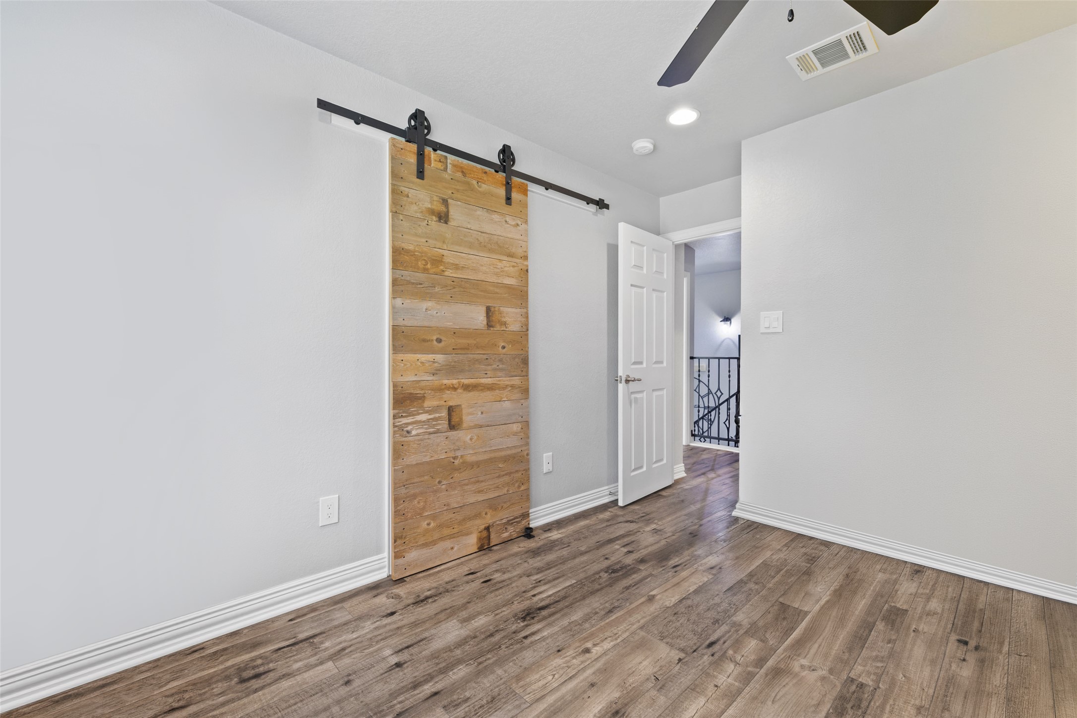134 Prairie Springs Cove Georgetown, TX 78626 - Photo 29 of 34 an empty room with wooden floor and windows