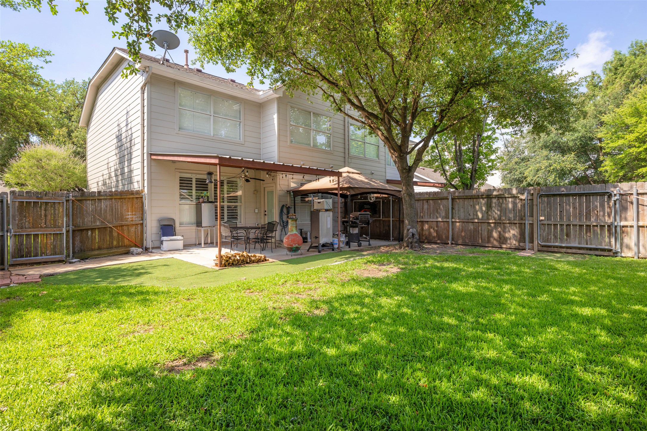 134 Prairie Springs Cove Georgetown, TX 78626 - Photo 31 of 34 a view of a house with a yard patio and a slide