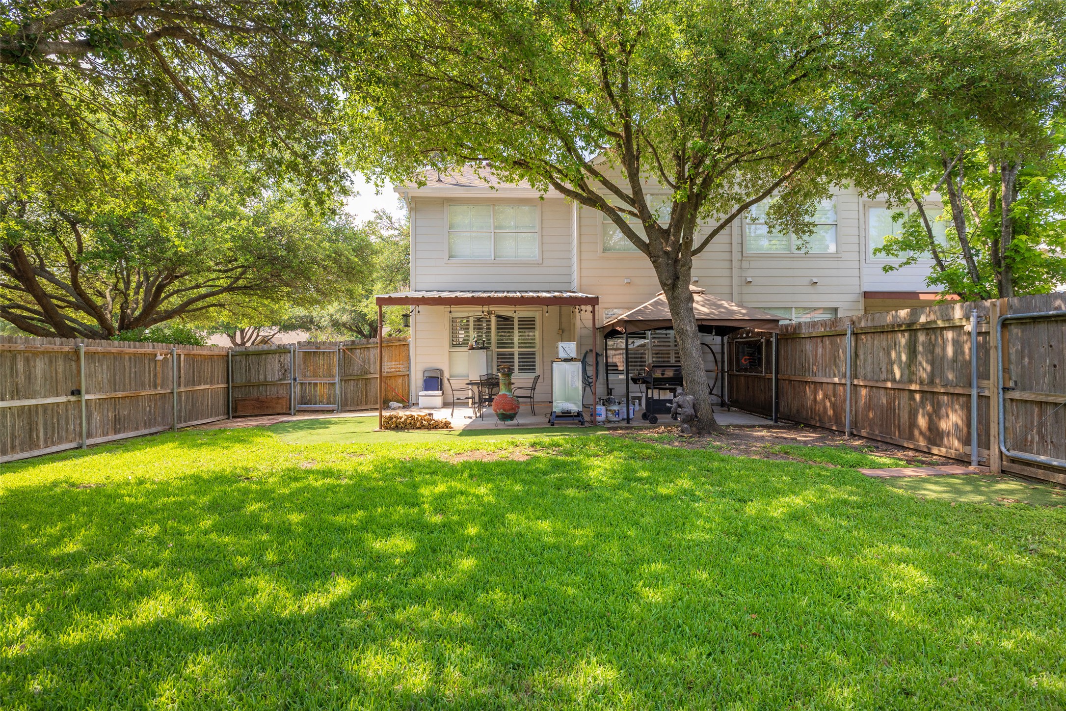 134 Prairie Springs Cove Georgetown, TX 78626 - Photo 32 of 34 a view of a house with backyard and a slide