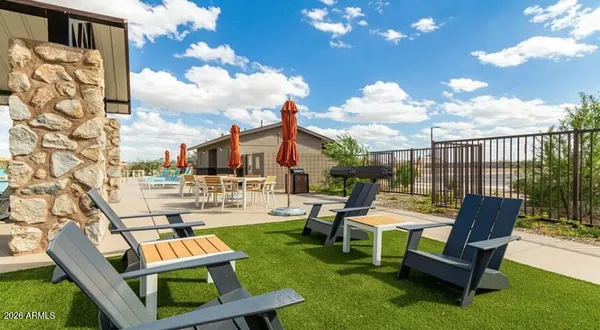 a view of a patio with table and chairs and potted plants