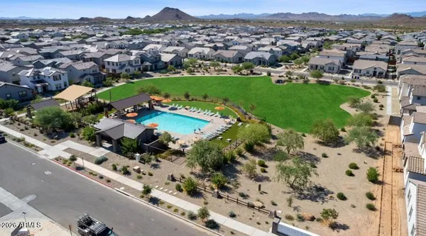 a view of a patio with table and chairs under an umbrella
