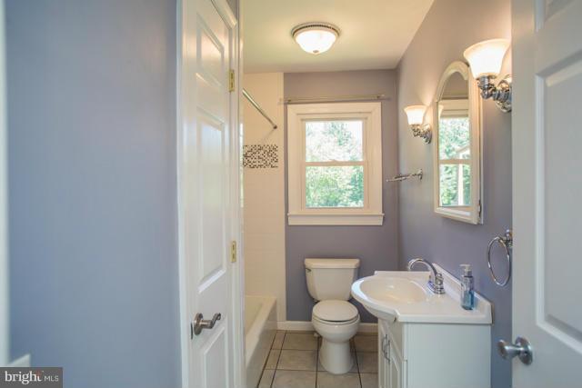 3351 Sykesville Road Westminster, MD 21157 - Photo 12 of 30 Full Bath with tiled shower, vanity, ceramic fl