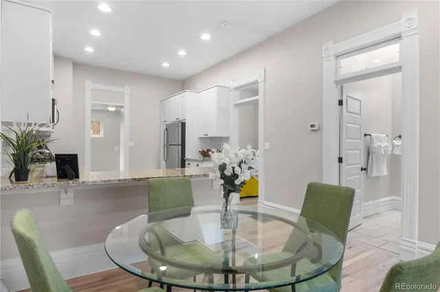 a view of a dining room with furniture and wooden floor