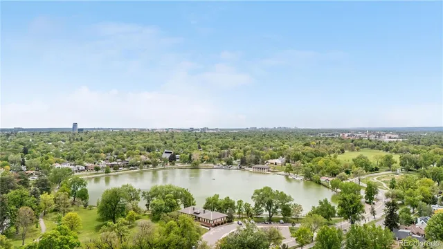 an aerial view of residential building and lake