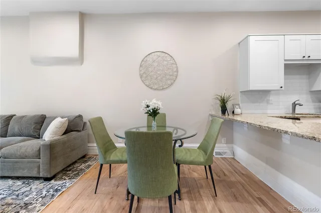 a view of kitchen with furniture and wooden floor