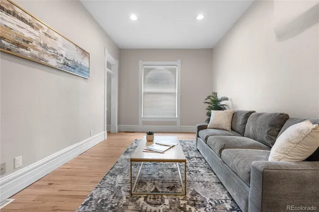 a living room with furniture and a rug