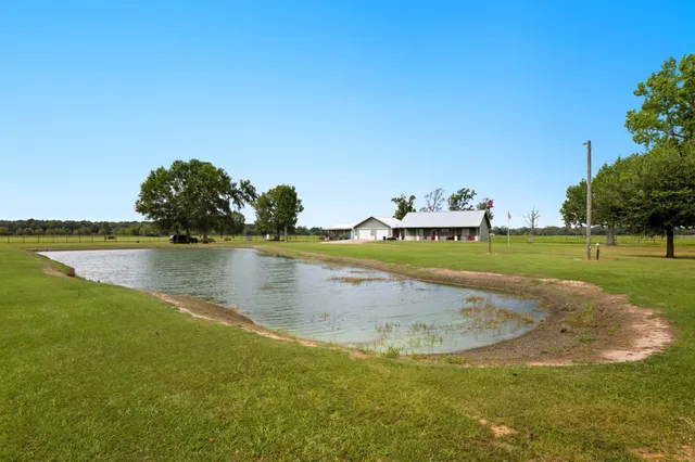 a view of a lake with a big yard
