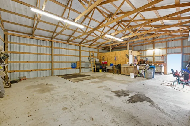 a living room with furniture and white walls