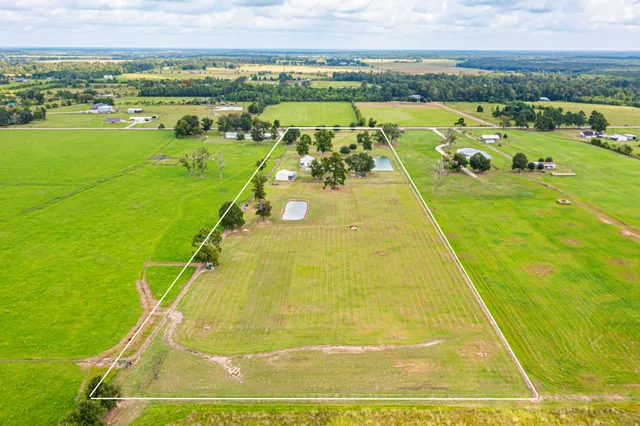 a view of a swimming pool and an outdoor seating