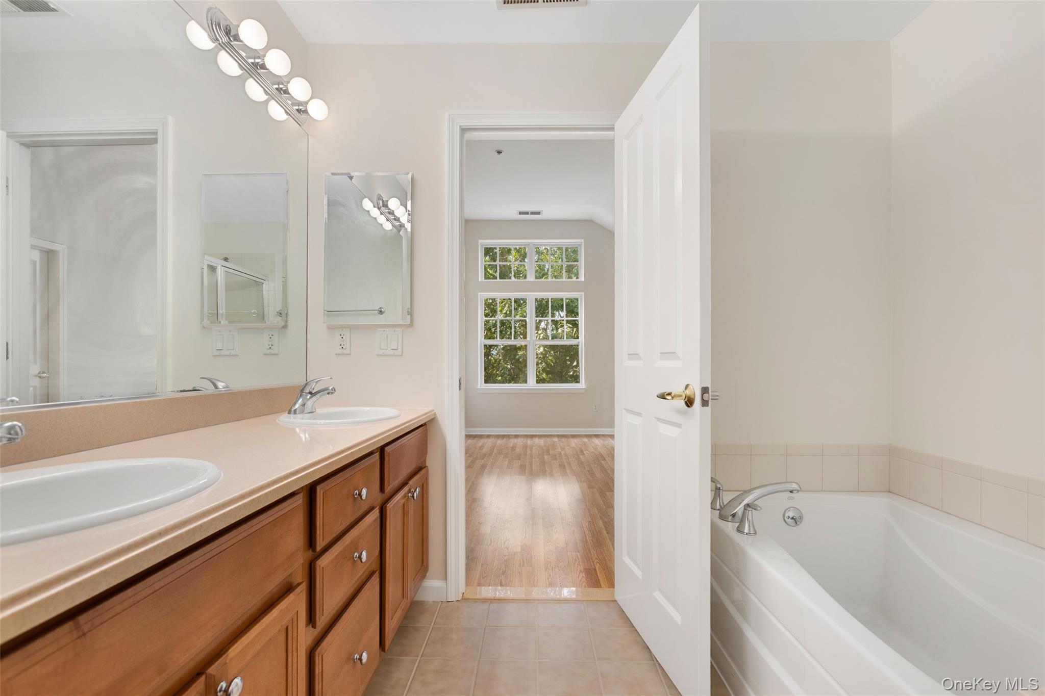 223 Viewpoint Terrace Peekskill, NY 10566 - Photo 15 of 30 Full bath with a bath, double vanity, light tile patterned floors, and a shower
