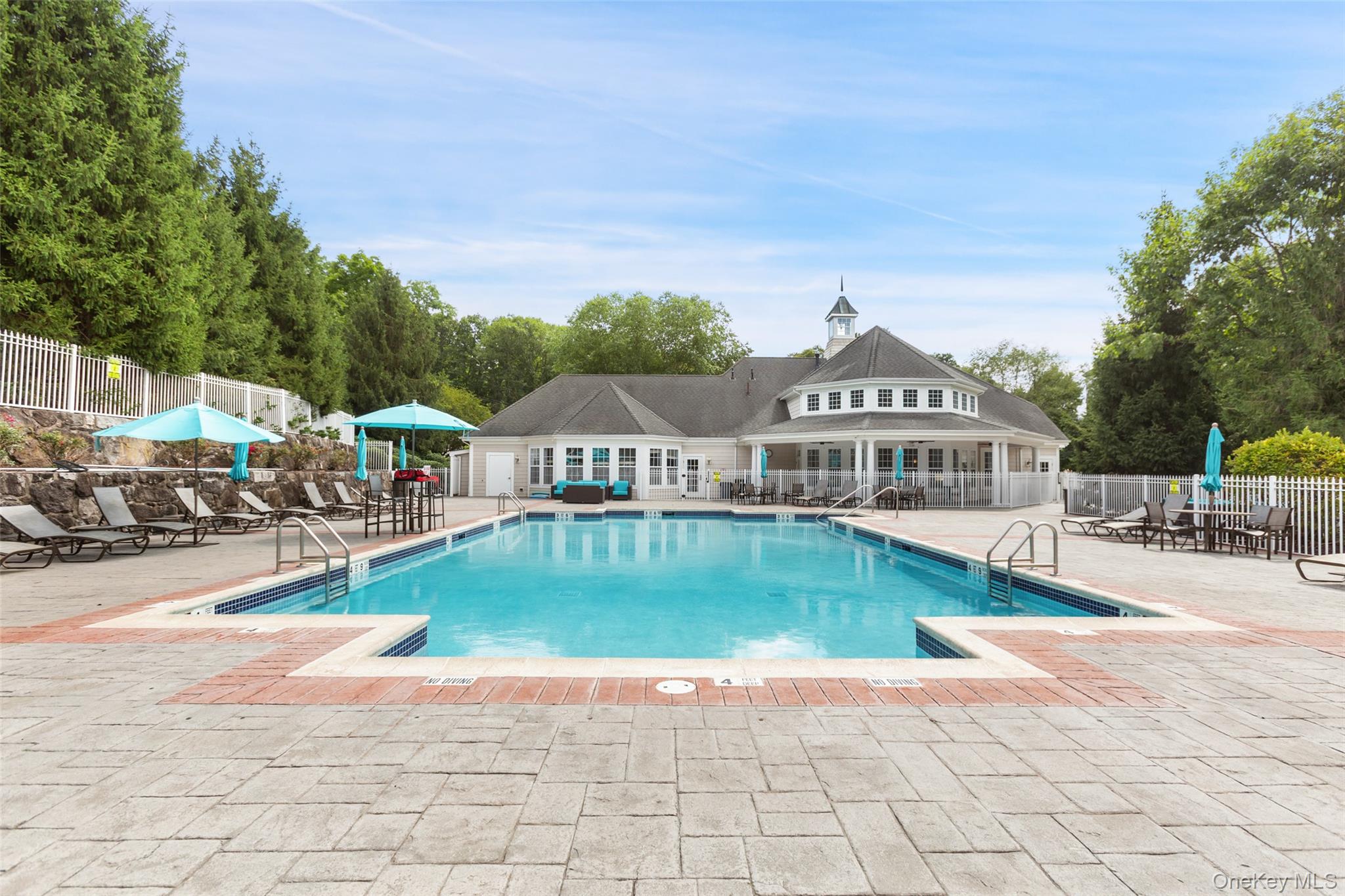 223 Viewpoint Terrace Peekskill, NY 10566 - Photo 25 of 30 Community pool featuring a patio and view of wooded area