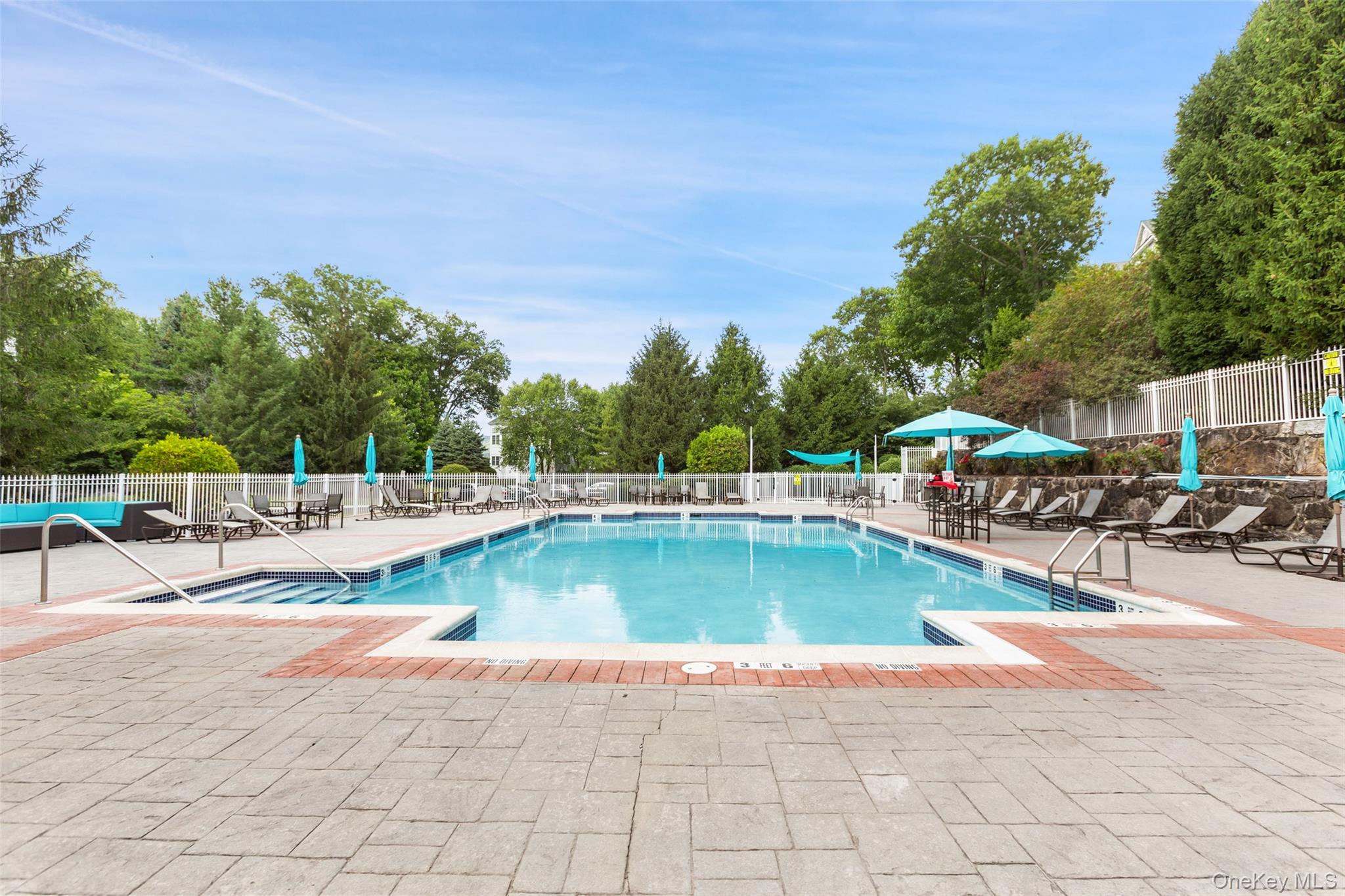 223 Viewpoint Terrace Peekskill, NY 10566 - Photo 26 of 30 Community pool featuring a patio area and view of wooded area