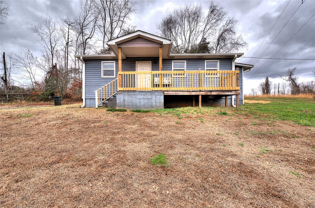 325 Rock Quarry Road Travelers Rest, SC 29690 - Photo 3 of 37 This charming home features a welcoming porch, perfect for enjoying peaceful surroundings.