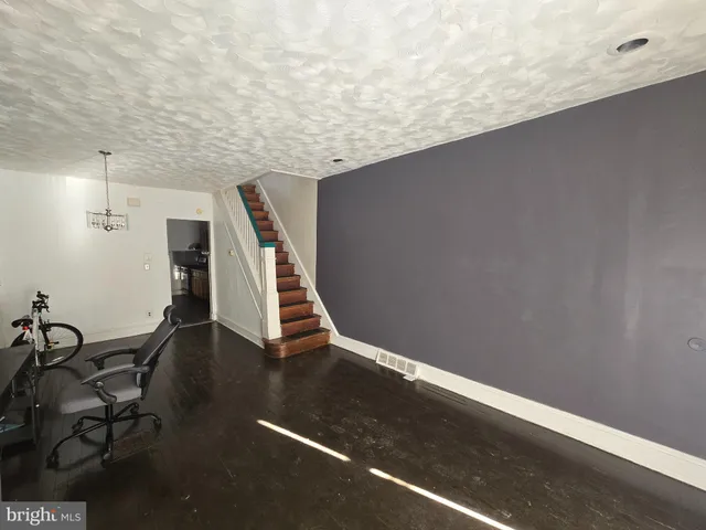 a view of wooden floor in an empty room