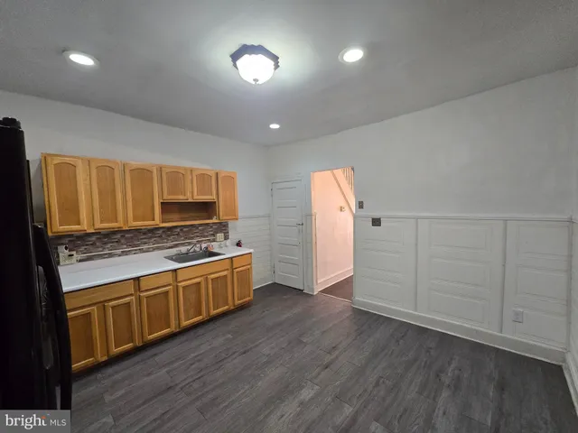 a view of a kitchen with a sink and a stove