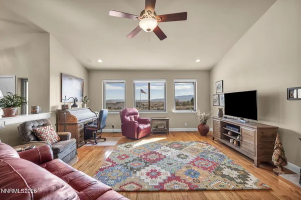 a table room with furniture and wooden floor