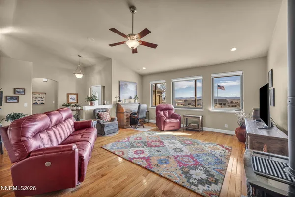 a kitchen with sink refrigerator dining table and chairs