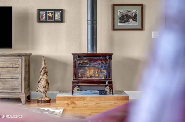 a kitchen with stainless steel appliances granite countertop hardwood floor sink stove and refrigerator