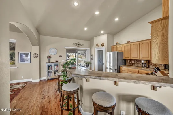 a kitchen with stainless steel appliances granite countertop a stove sink and cabinets